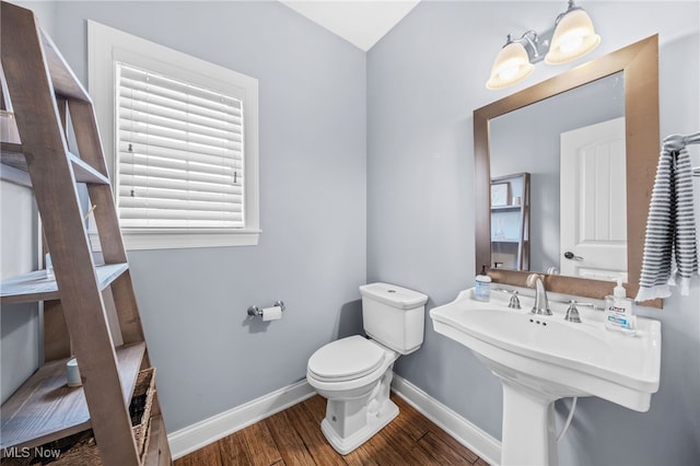 2940 Londonbury St NW, Uniontown, OH 44685 - bathroom with wood finished floors and toilet