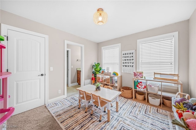 2940 Londonbury St NW, Uniontown, OH 44685 - recreation room featuring carpet and baseboards