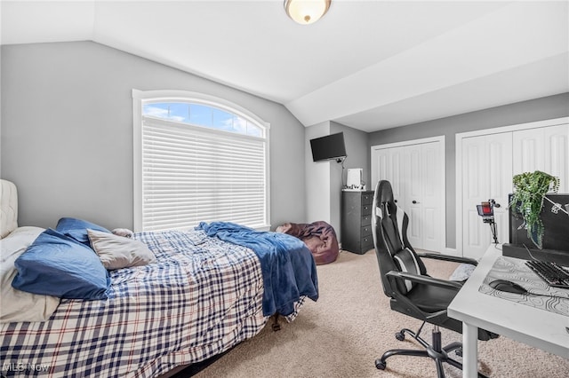 2940 Londonbury St NW, Uniontown, OH 44685 - carpeted bedroom featuring lofted ceiling, an office area, and two closets