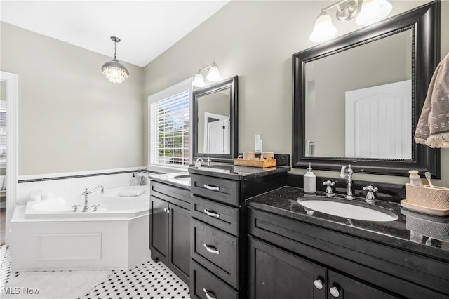 2940 Londonbury St NW, Uniontown, OH 44685 - full bath featuring double vanity and a bath