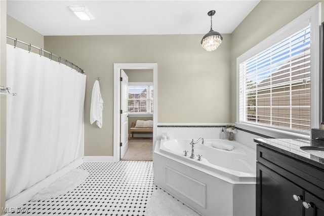 2940 Londonbury St NW, Uniontown, OH 44685 - full bath with a garden tub, healthy amount of natural light, vanity, and a shower with curtain