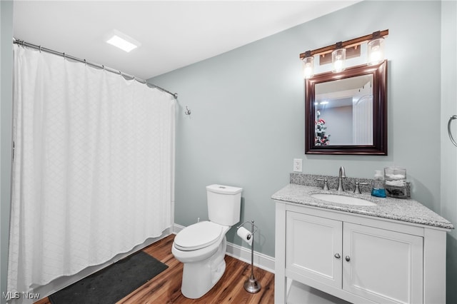 2940 Londonbury St NW, Uniontown, OH 44685 - full bath with wood finished floors, vanity, and curtained shower