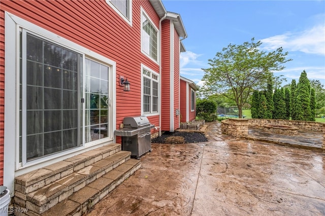 2940 Londonbury St NW, Uniontown, OH 44685 - view of patio with a trampoline and area for grilling