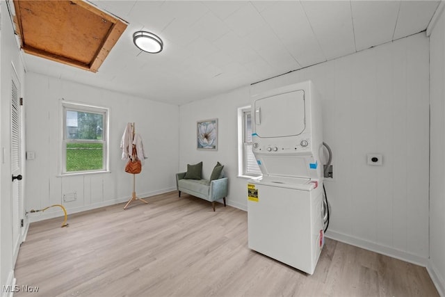 85 Pocantico Ave, Akron, OH 44312 - laundry room featuring stacked washing machine and dryer and light wood-type flooring