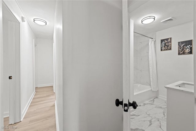 85 Pocantico Ave, Akron, OH 44312 - bathroom featuring vanity, marble look tiles, and shower / bathtub combination with curtain