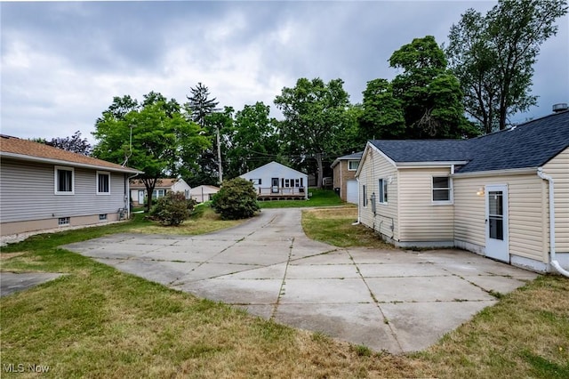 85 Pocantico Ave, Akron, OH 44312 - view of green lawn with a patio area