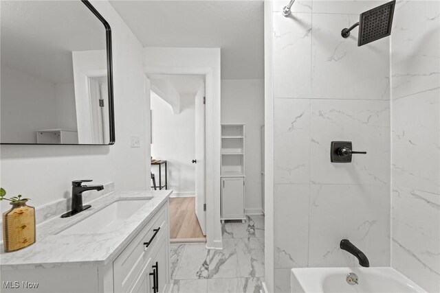 85 Pocantico Ave, Akron, OH 44312 - bathroom featuring marble finish flooring, vanity, and bathing tub / shower combination