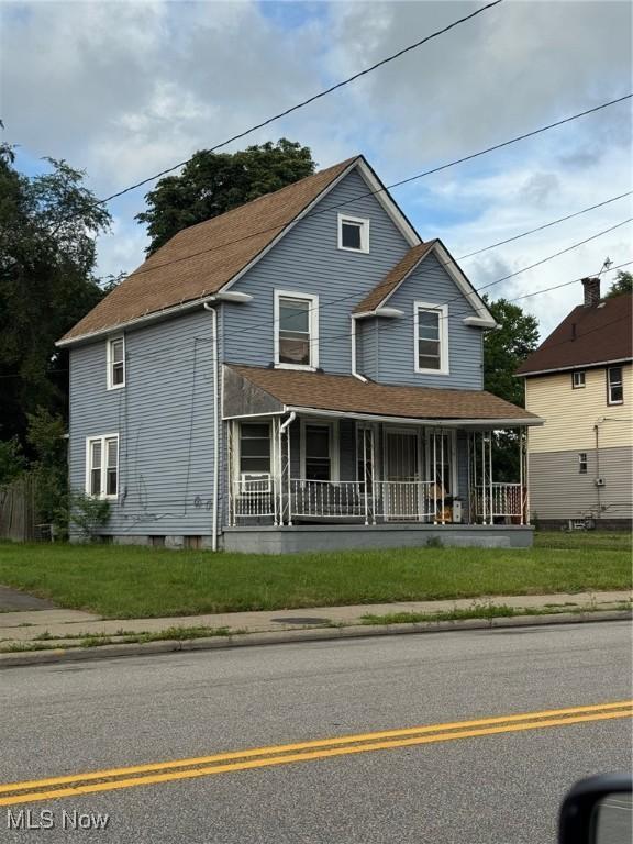 3569 Independence Rd, Cleveland, OH 44105 - view of front facade with a porch and roof with shingles