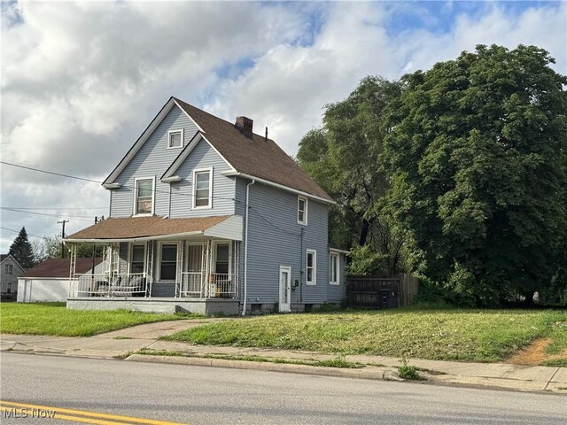 3569 Independence Rd, Cleveland, OH 44105 - view of front of property with covered porch, a chimney, and roof with shingles