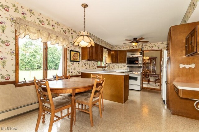 13228 Boulder, Chesterland, OH 44026 - dining space with wallpapered walls, a baseboard heating unit, and a ceiling fan