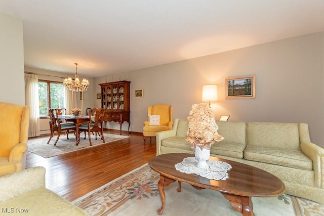 13228 Boulder, Chesterland, OH 44026 - living area with a chandelier and wood finished floors