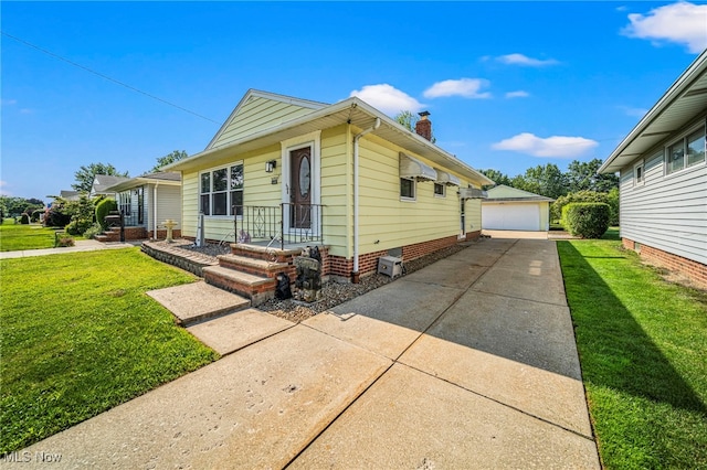 28666 Forest Rd, Willowick, OH 44095 - view of front of house with a chimney, a front yard, an outbuilding, and a garage