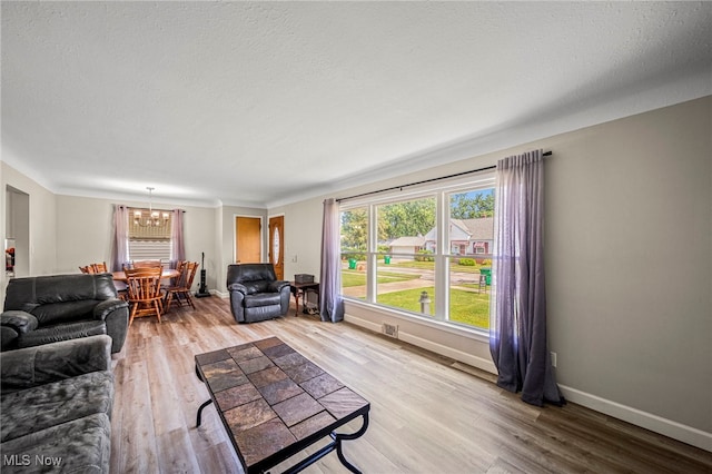 28666 Forest Rd, Willowick, OH 44095 - living area with a chandelier and wood finished floors