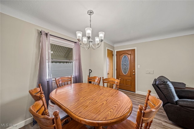 28666 Forest Rd, Willowick, OH 44095 - dining room featuring a chandelier and wood finished floors