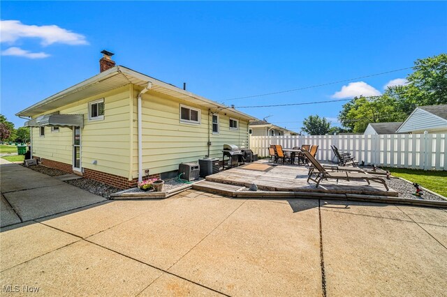 28666 Forest Rd, Willowick, OH 44095 - back of property featuring a chimney, a patio area, and a deck