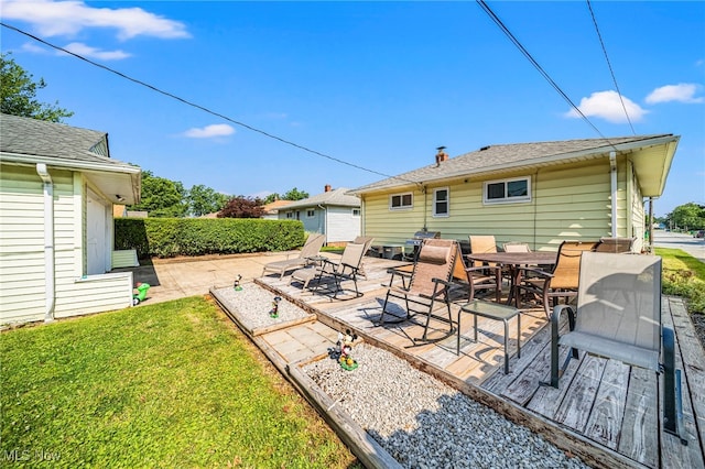28666 Forest Rd, Willowick, OH 44095 - back of house featuring a patio area, outdoor dining area, and a yard