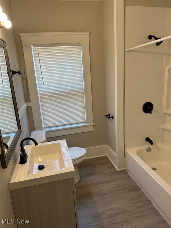 1114 E 64th St, Cleveland, OH 44103 - full bathroom with vanity, wood finished floors, and shower / bathtub combination