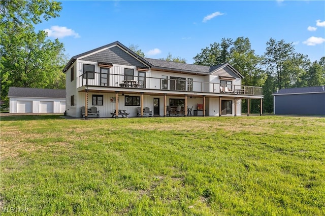 5111 N Myers Rd, Geneva, OH 44041 - back of house with a wooden deck, a yard, and a detached garage