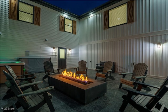 5111 N Myers Rd, Geneva, OH 44041 - patio at twilight featuring an outdoor fire pit and a patio area