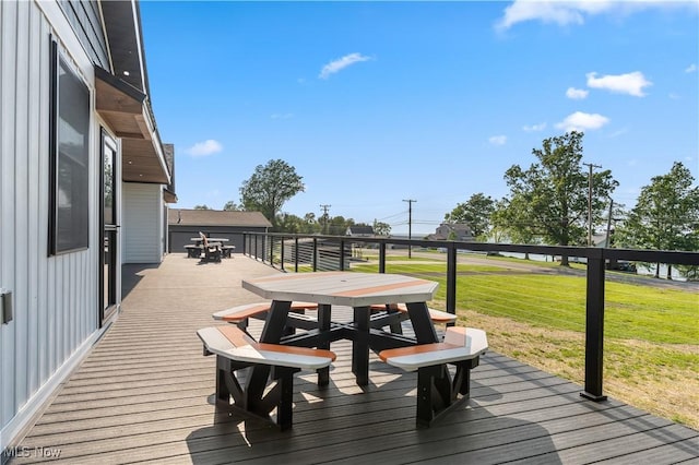 5111 N Myers Rd, Geneva, OH 44041 - wooden deck featuring outdoor dining space and a yard