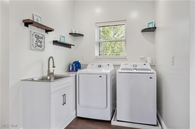 5111 N Myers Rd, Geneva, OH 44041 - laundry area with washing machine and dryer, dark wood-type flooring, and cabinet space