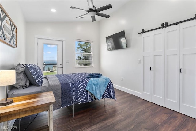 5111 N Myers Rd, Geneva, OH 44041 - bedroom featuring vaulted ceiling, wood finished floors, a barn door, recessed lighting, and a ceiling fan