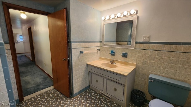 138 Marsha St, Weirton, WV 26062 - bathroom with vanity, tile walls, and a wainscoted wall