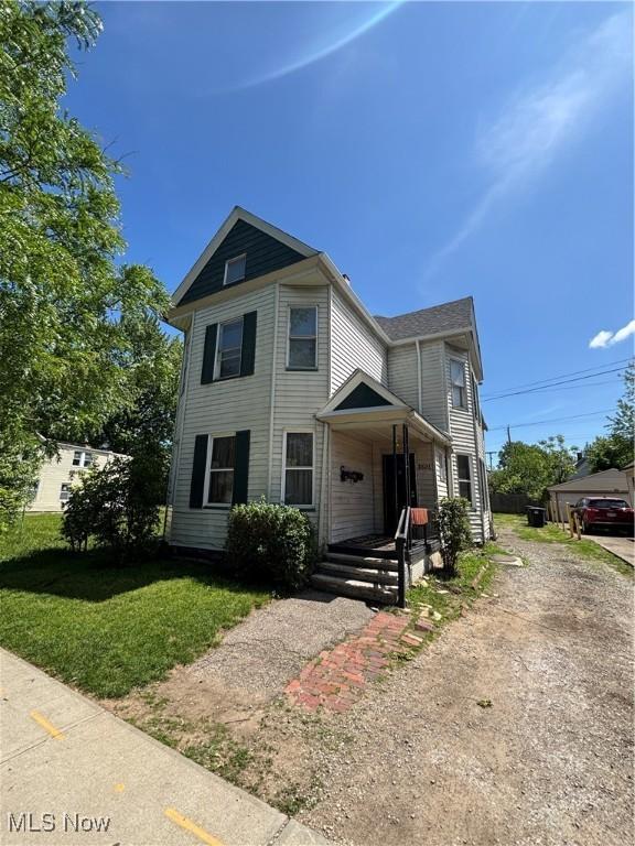 3821 E 55th St, Cleveland, OH 44105 - view of front of property featuring a front lawn