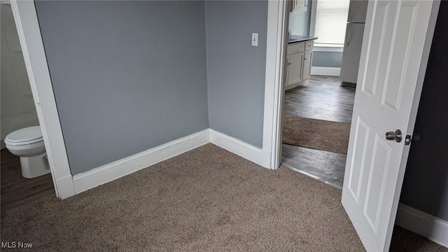 3821 E 55th St, Cleveland, OH 44105 - empty room with dark carpet and baseboards