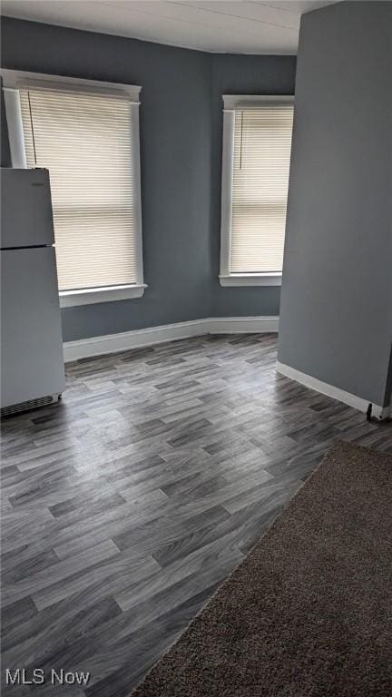 3821 E 55th St, Cleveland, OH 44105 - empty room with wood finished floors and healthy amount of natural light
