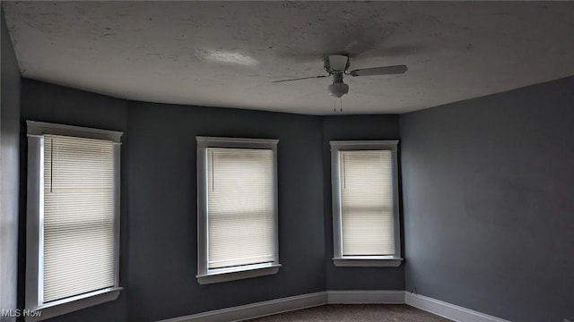 3821 E 55th St, Cleveland, OH 44105 - carpeted empty room with baseboards and ceiling fan