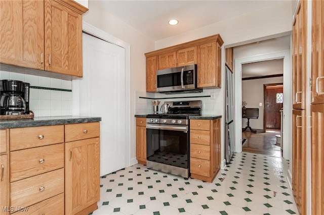 3336 Daleford Rd, Shaker Heights, OH 44120 - kitchen featuring appliances with stainless steel finishes, light flooring, backsplash, and recessed lighting