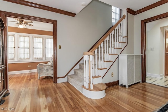 3336 Daleford Rd, Shaker Heights, OH 44120 - stairs with ornamental molding, hardwood / wood-style flooring, and ceiling fan