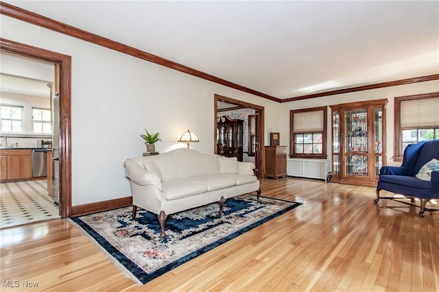 3336 Daleford Rd, Shaker Heights, OH 44120 - living room with light wood finished floors, ornamental molding, and radiator heating unit