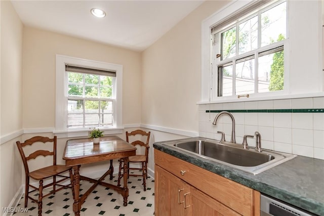 3336 Daleford Rd, Shaker Heights, OH 44120 - kitchen featuring dark countertops, tasteful backsplash, recessed lighting, light flooring, and stainless steel dishwasher