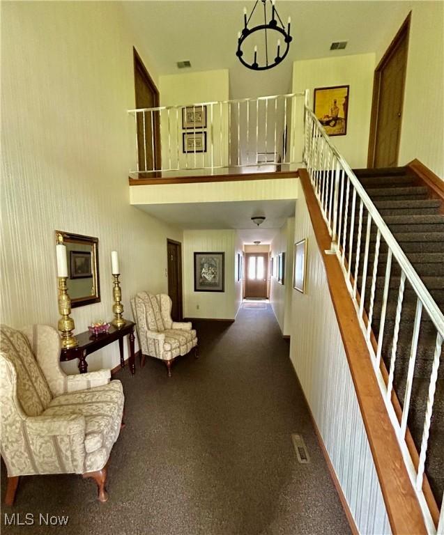 930 Pearson Cir Unit 4, Youngstown, OH 44512 - hallway with a chandelier and a towering ceiling