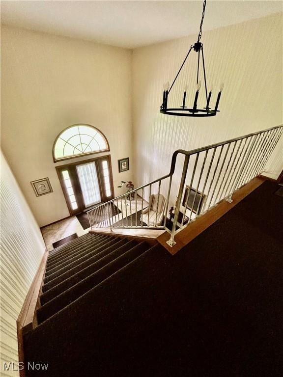 930 Pearson Cir Unit 4, Youngstown, OH 44512 - stairway featuring a chandelier