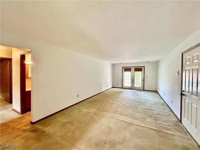 930 Pearson Cir Unit 4, Youngstown, OH 44512 - empty room with light colored carpet and french doors