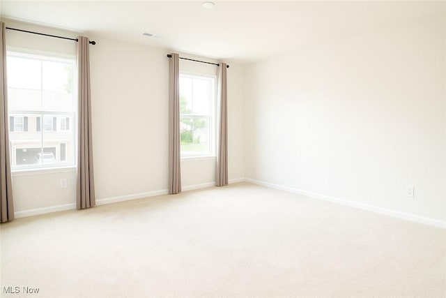 1627 Cypress Rd, Stow, OH 44224 - spare room with plenty of natural light and light carpet