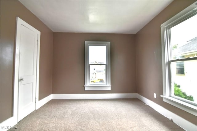 1134 Auburn Pl NW, Canton, OH 44703 - carpeted empty room featuring baseboards