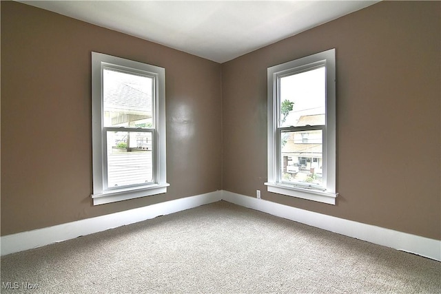 1134 Auburn Pl NW, Canton, OH 44703 - carpeted spare room featuring baseboards