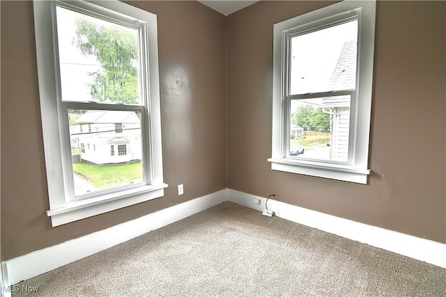1134 Auburn Pl NW, Canton, OH 44703 - carpeted spare room featuring plenty of natural light