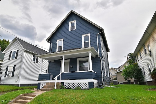 1134 Auburn Pl NW, Canton, OH 44703 - american foursquare style home with covered porch and a front lawn
