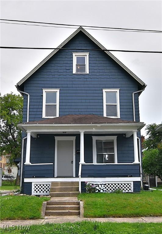 1134 Auburn Pl NW, Canton, OH 44703 - traditional style home with a porch and a front yard
