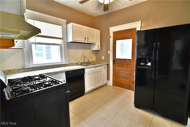 1134 Auburn Pl NW, Canton, OH 44703 - kitchen featuring black appliances, exhaust hood, white cabinets, light tile patterned floors, and ceiling fan