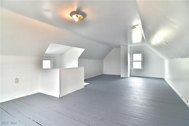 1134 Auburn Pl NW, Canton, OH 44703 - bonus room featuring dark wood-type flooring and vaulted ceiling