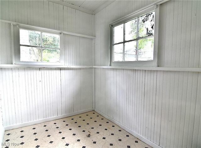 1134 Auburn Pl NW, Canton, OH 44703 - spare room with tile patterned floors and wood walls
