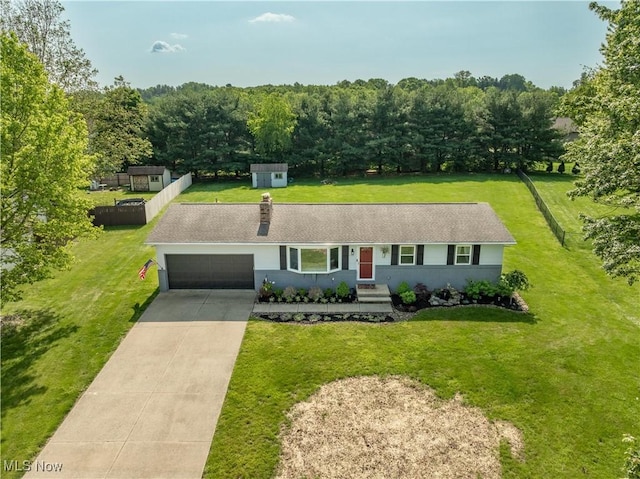11576 Peach Glen Ave NW, Uniontown, OH 44685 - view of front of property featuring a garage, concrete driveway, and a front lawn