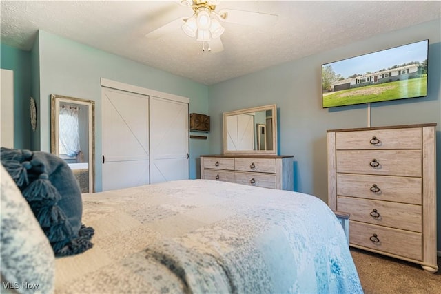 11576 Peach Glen Ave NW, Uniontown, OH 44685 - bedroom with carpet flooring, a closet, a ceiling fan, and a textured ceiling