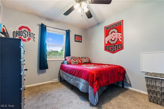 11576 Peach Glen Ave NW, Uniontown, OH 44685 - carpeted bedroom with a ceiling fan and a textured ceiling